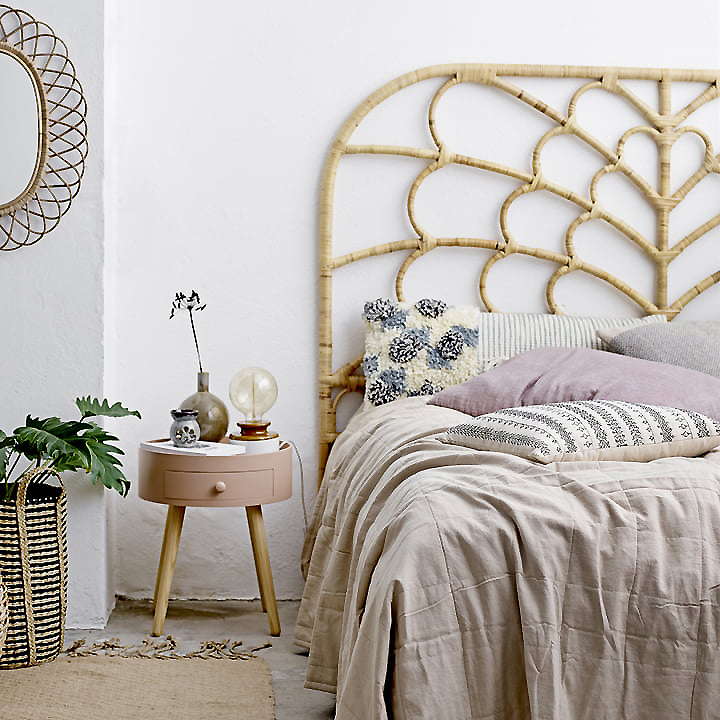 Tie together a disparate scheme with a bold statement headboard. Image: Bloomingville