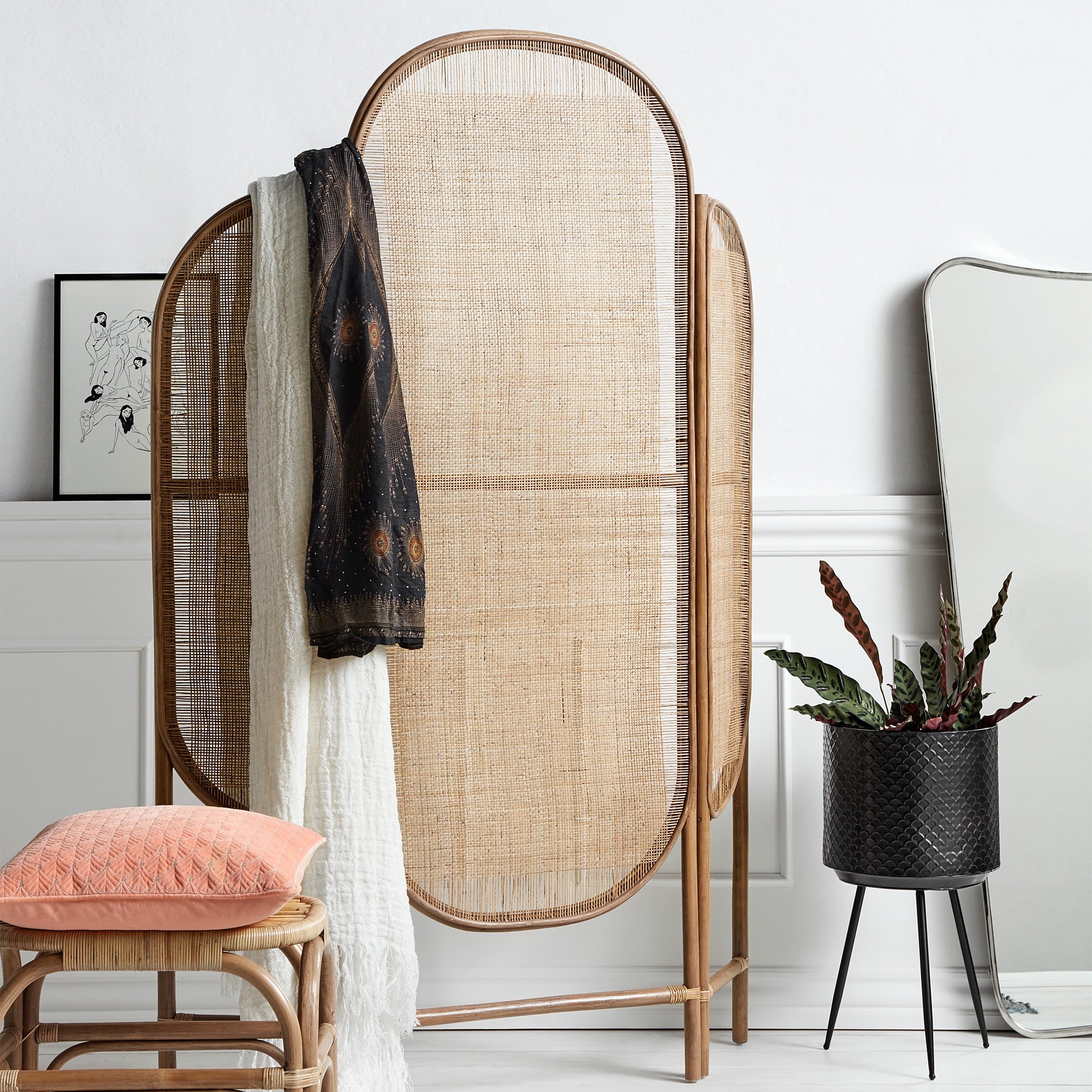A folding screen with rustic woven panels adds heritage charm. Image: Out There Interiors