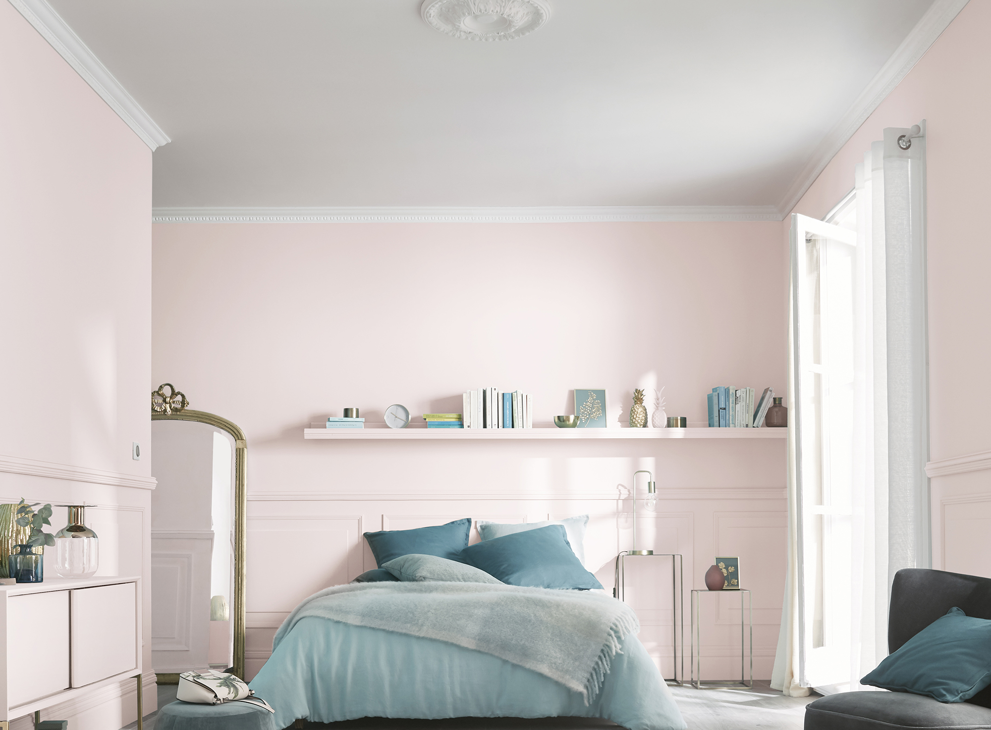 A dado rail and panelling add heritage charm to this modern blush pink bedroom. Image: B&Q