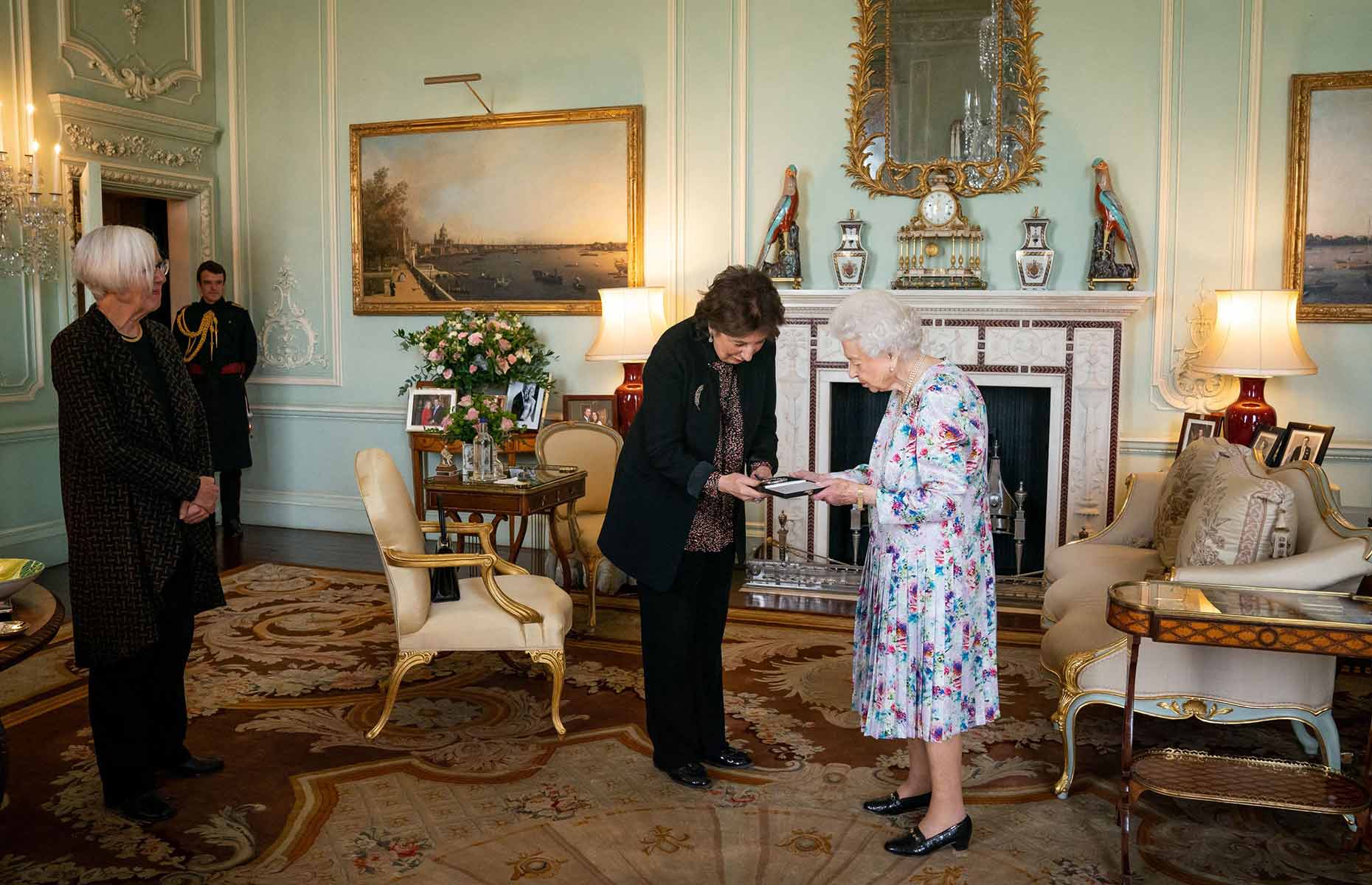 The Queen presents an award in one of the palace's many state rooms. Image: Aaron Chown / AFP / Getty Images