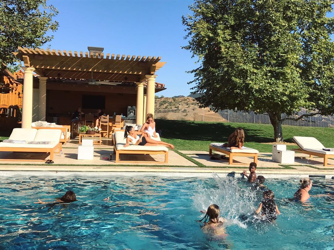 This Mediterranean-style outdoor kitchen is the perfect addition to a pool party. Image: @kourtneykardash/Instagram